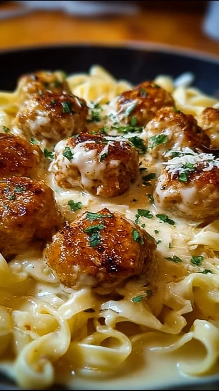 Garlic Butter Chicken Balls served with creamy Parmesan pasta on a plate.